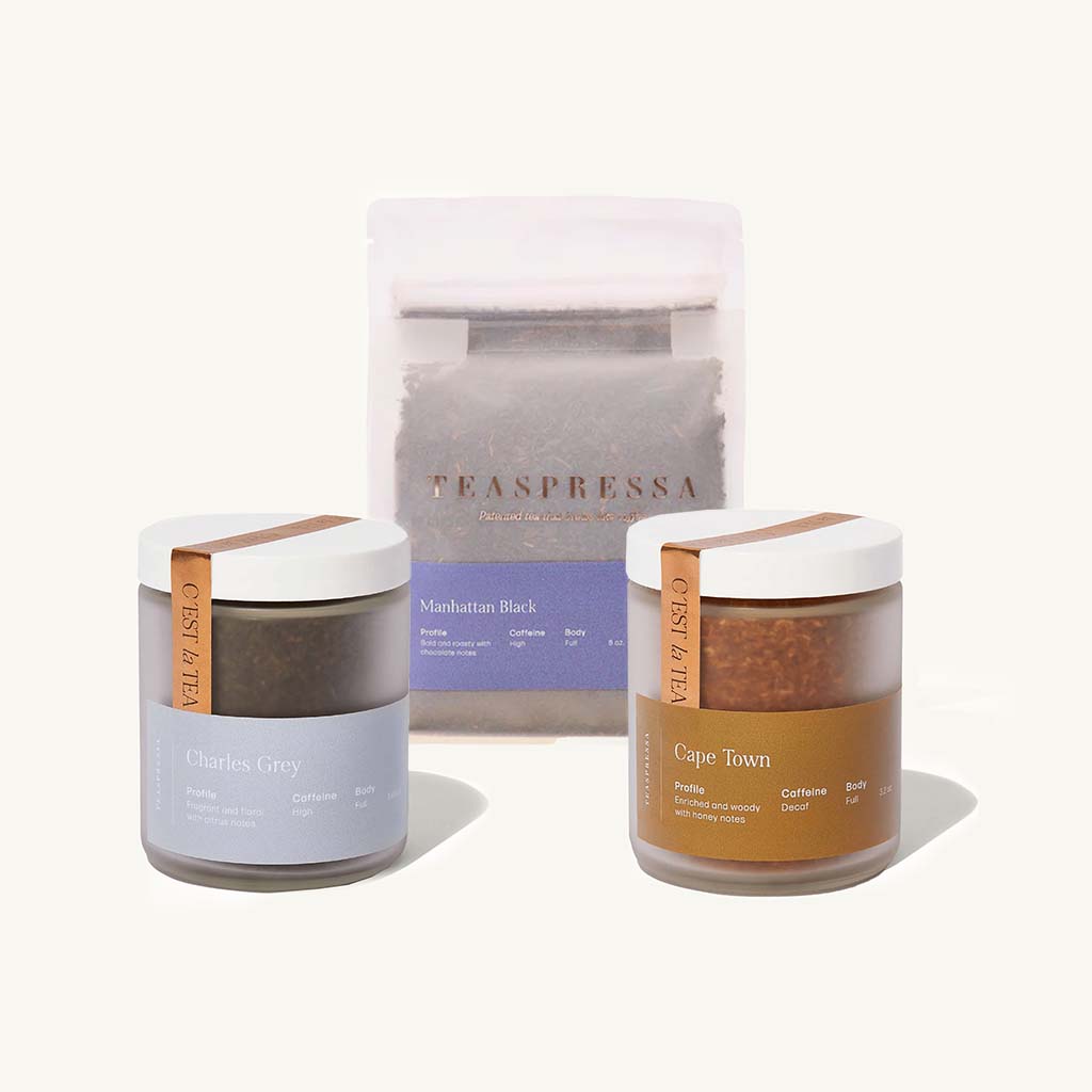 Manhattan Black Tea Pouch, Charles Grey Tea Jar, and Cape Town Tea Jar on an off white background.