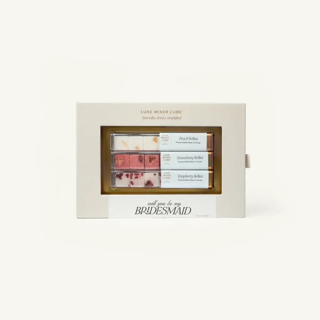 A boxed set of three small rectangular chocolate bars displayed in a cream-colored gift box with the text 'LUXE MAKER CUBE' and 'call you to my BRIDESMAID'.