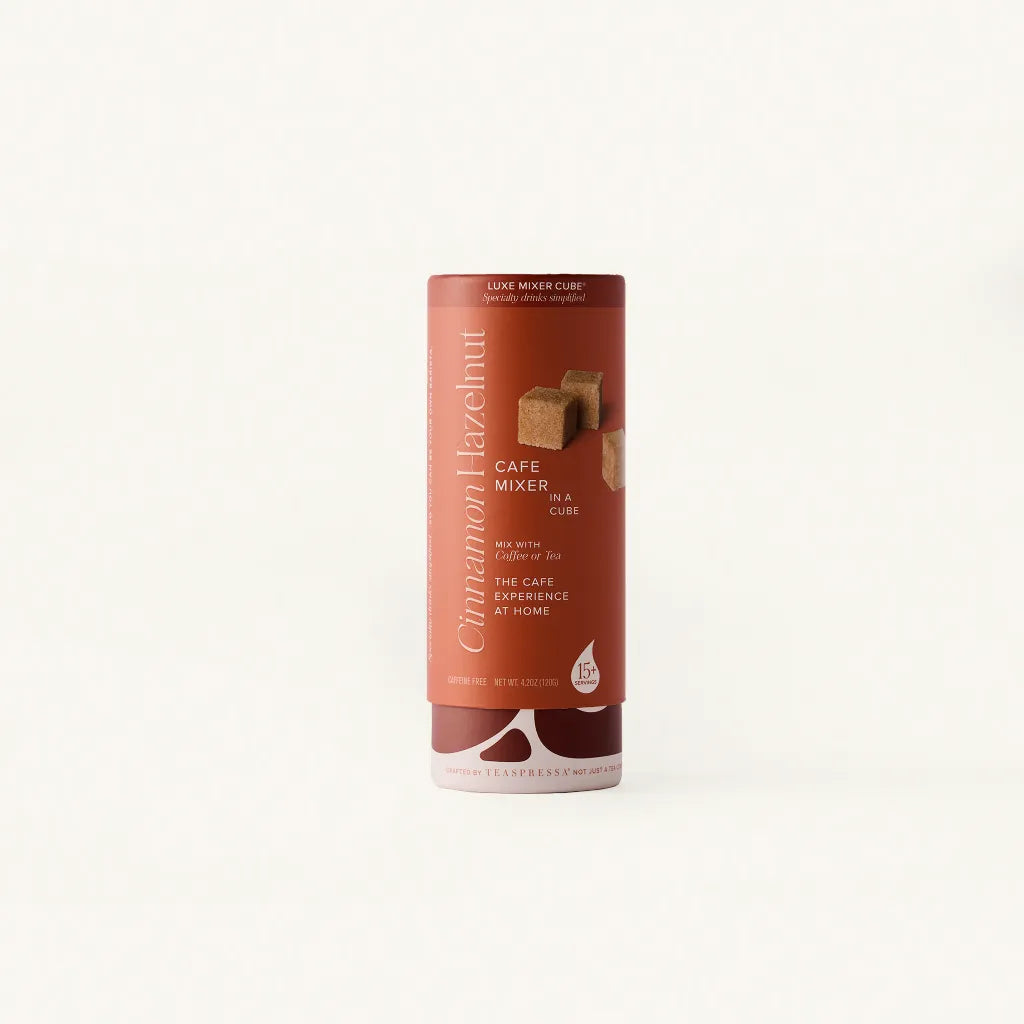 Cinnamon Hazelnut Luxe Mixer Cube tallboy in Rust packaging over clean off white background.