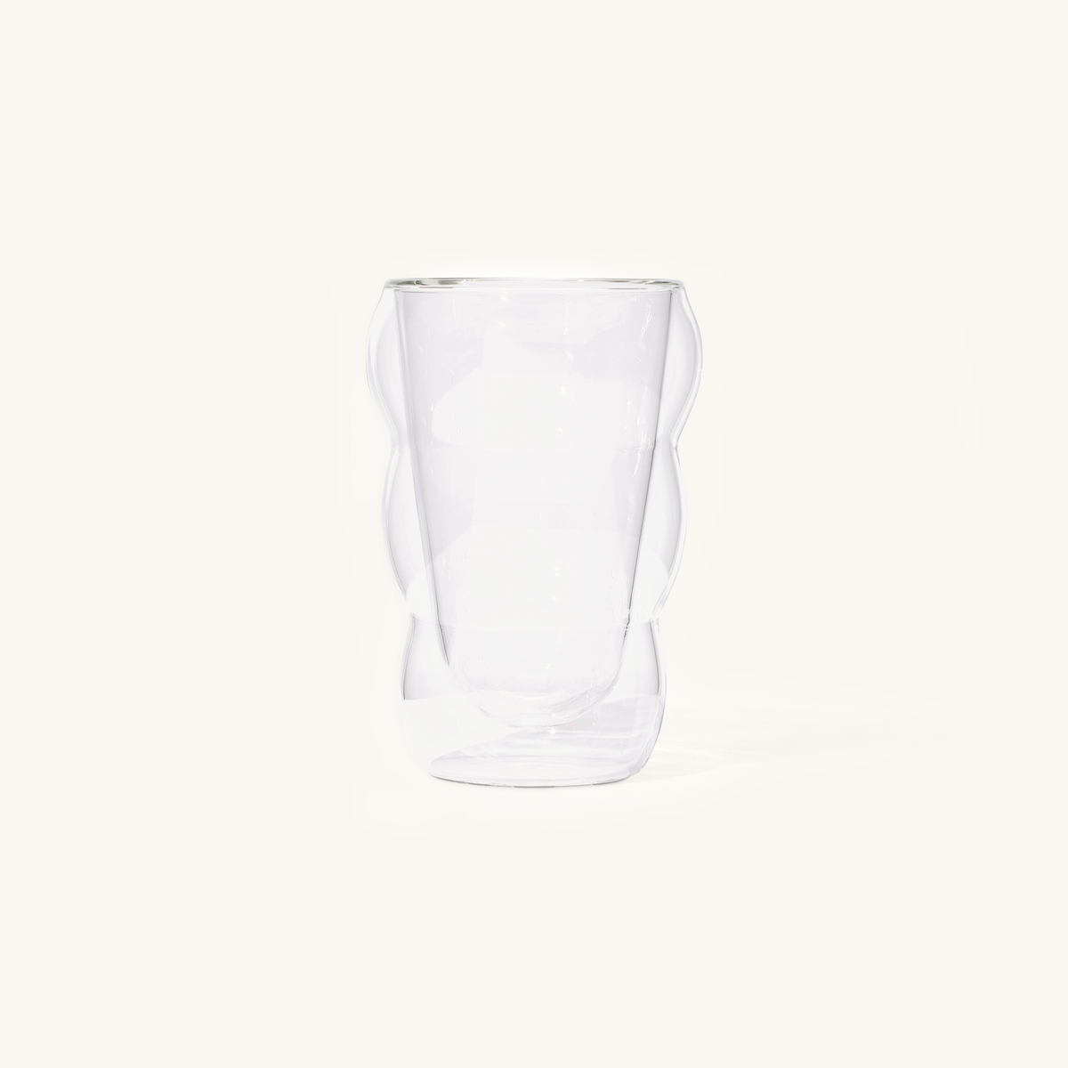Double walled Clear Cloud Cup on an off white background.