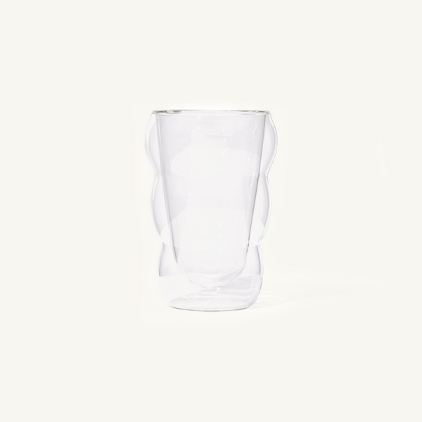 Double walled Clear Cloud Cup on an off white background.