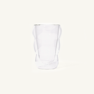 Double walled Clear Cloud Cup on an off white background.