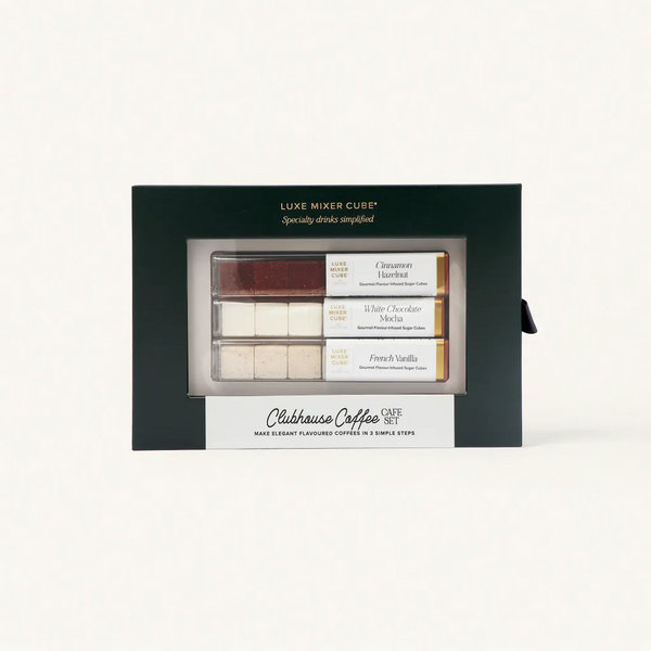 A boxed set labeled Clubhouse Coffee Café Set containing flavored drink cubes in three varieties: Cinnamon Brown Sugar, White Chocolate Mocha, and French Vanilla, displayed in a green and cream package.