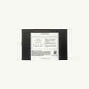 The back of a black rectangular box with a large white instruction label, photographed against a plain off-white background. The label includes product information, dropper illustrations, and the brand name CHEERS TO YOU.