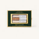 Hot cocoa mix set in a green box with gold accents on a white background