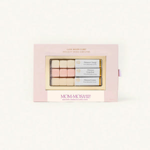 Mom-Mosa makeup set with pastel shades in a pink box on a white background