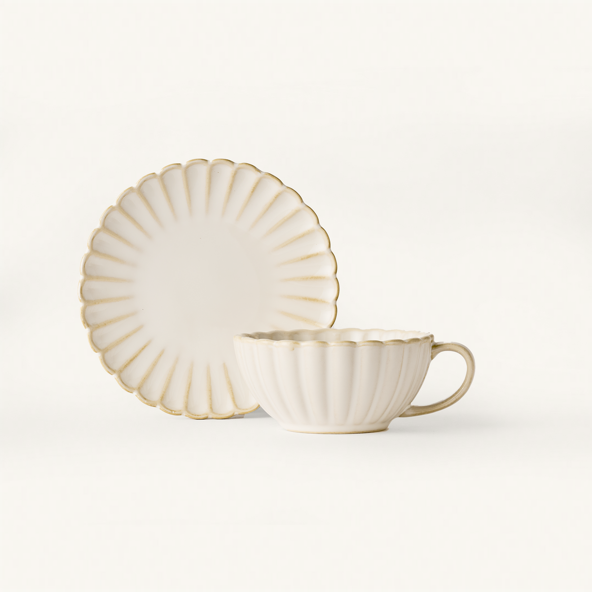 Scalloped ceramic café set in cream